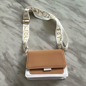 White and brown purse
